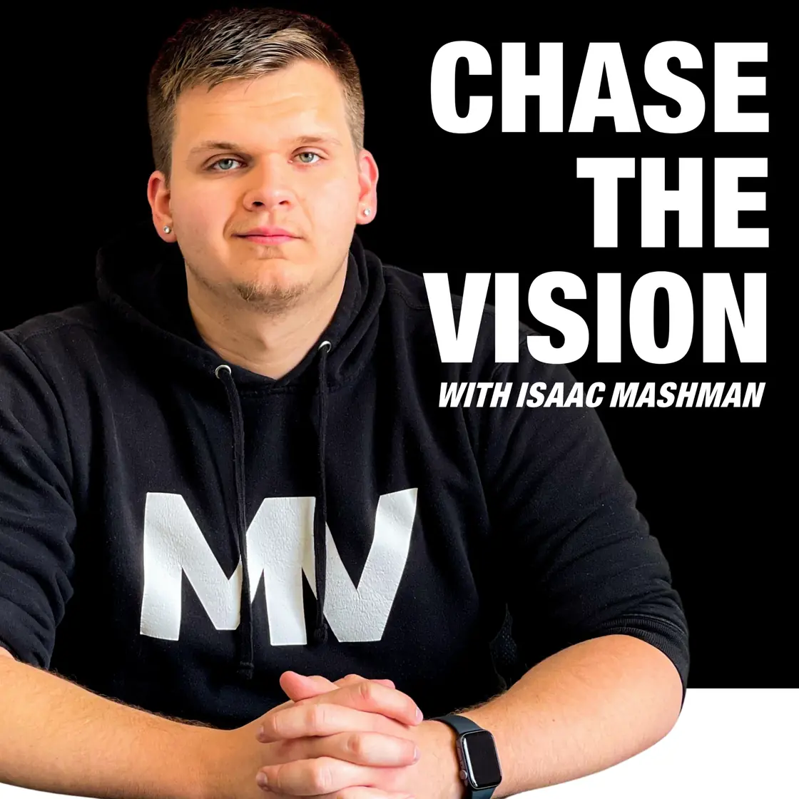 The Chase the Vision cover after the rebrand: Isaac in a black hoodie with the MV mark, seated with his hands folded, the title in heavy white capitals with With Isaac Mashman beneath
