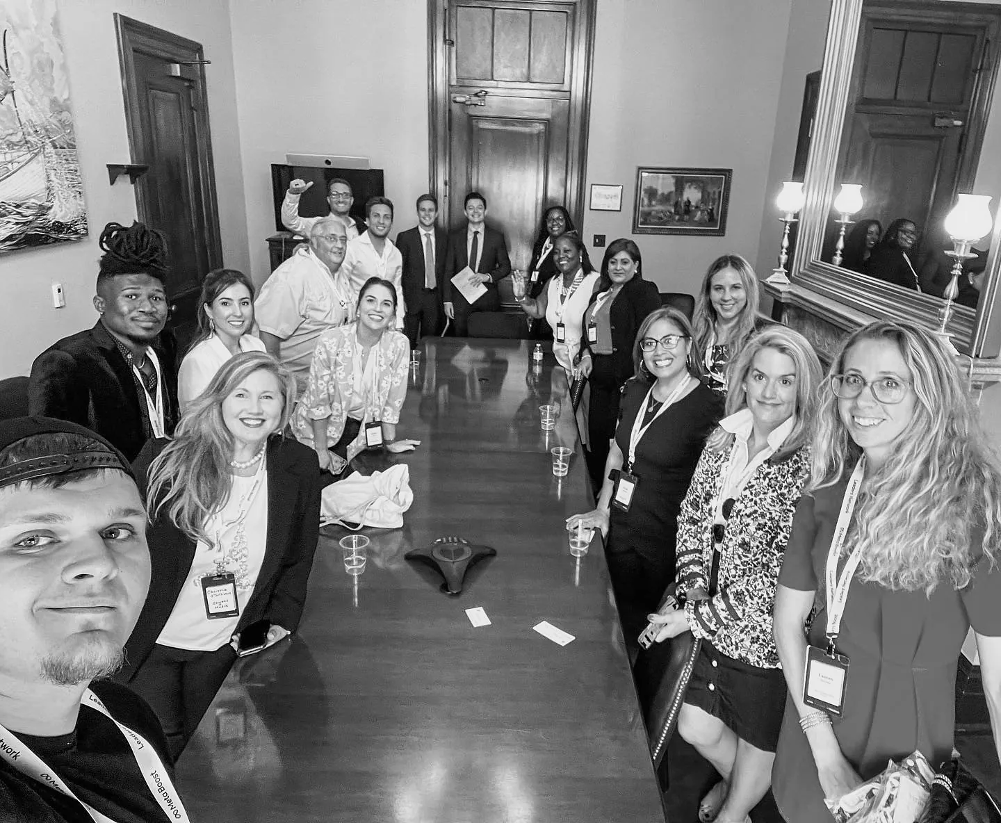 Isaac Mashman taking a selfie with fellow attendees around a conference table at Meta Boost Gather in Washington, D.C.